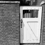 old gate in brick wall