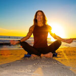 yoga on the beach at sunset