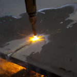 flame cutting a sheet of steel
