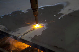 flame cutting a sheet of steel